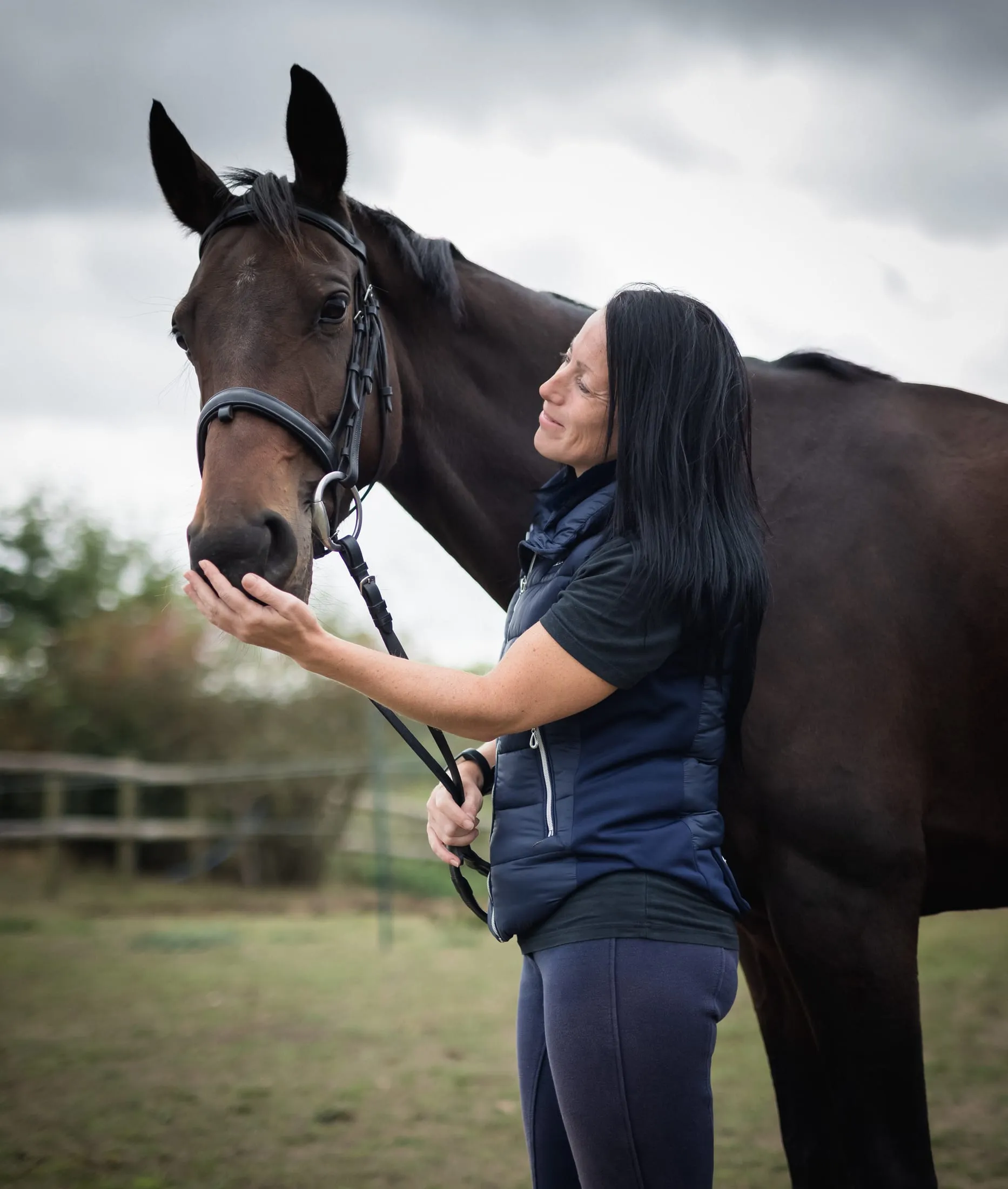 A woman embracing her horse