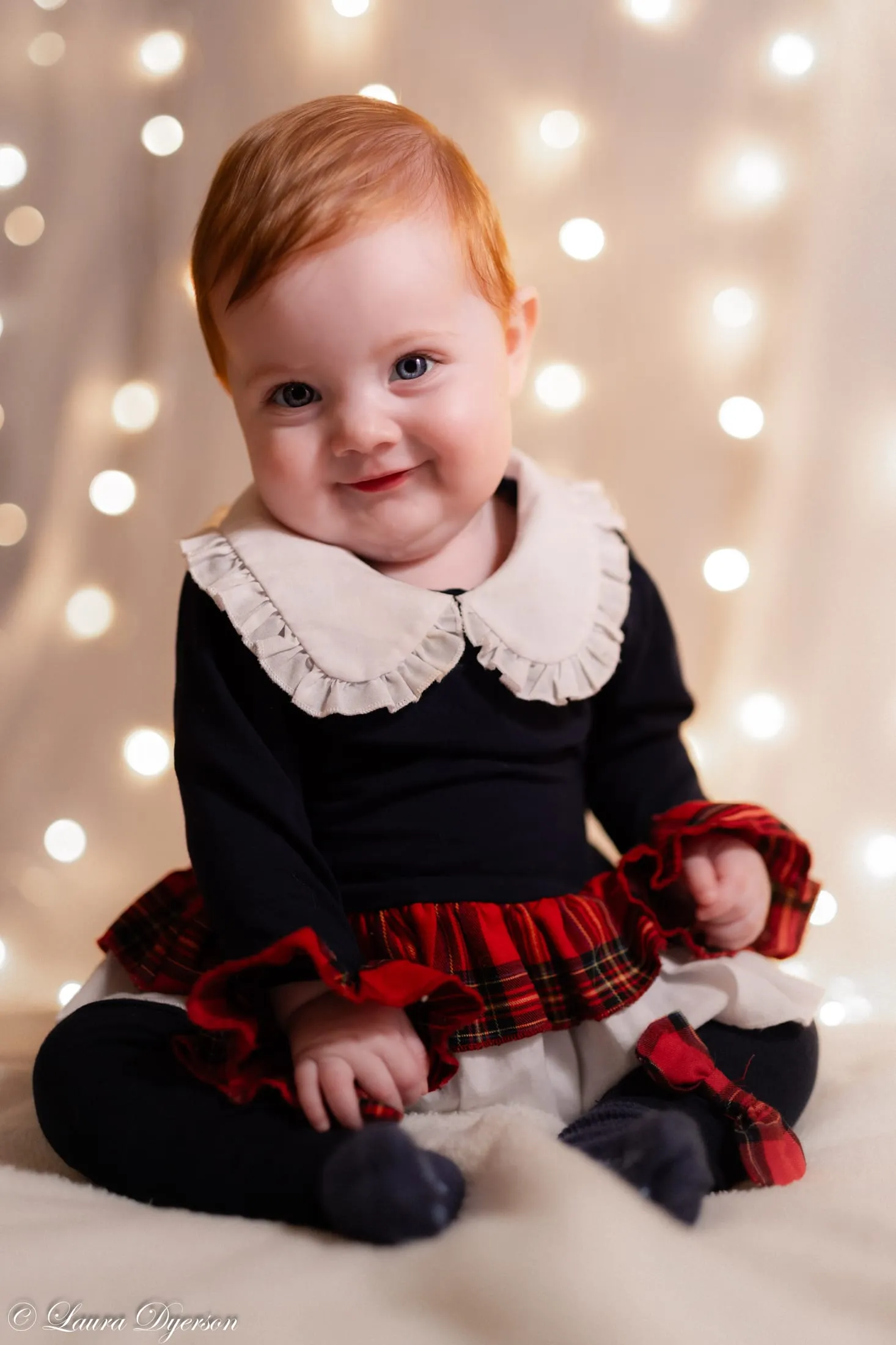 Baby in a frilled collar, soft bokeh light
